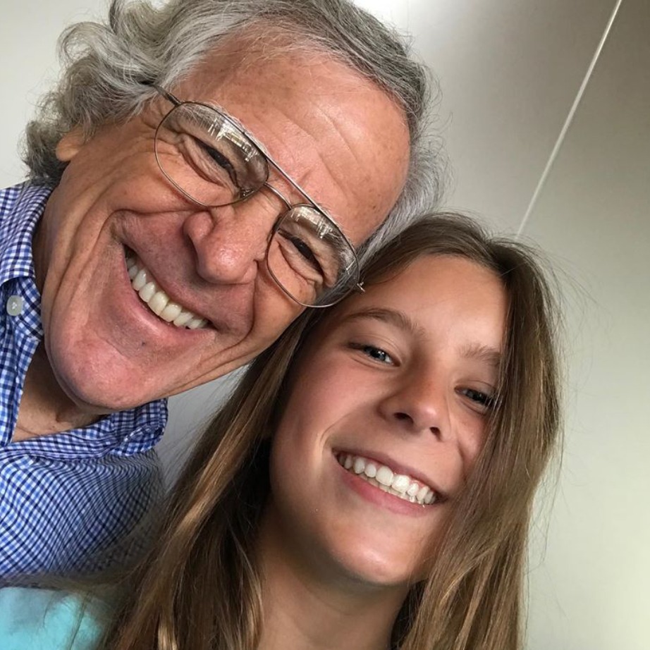 Orthodontist Dr. Rothenberg smiling with a young patient, both showcasing bright, confident smiles, emphasizing the transformative power of orthodontic treatment.
